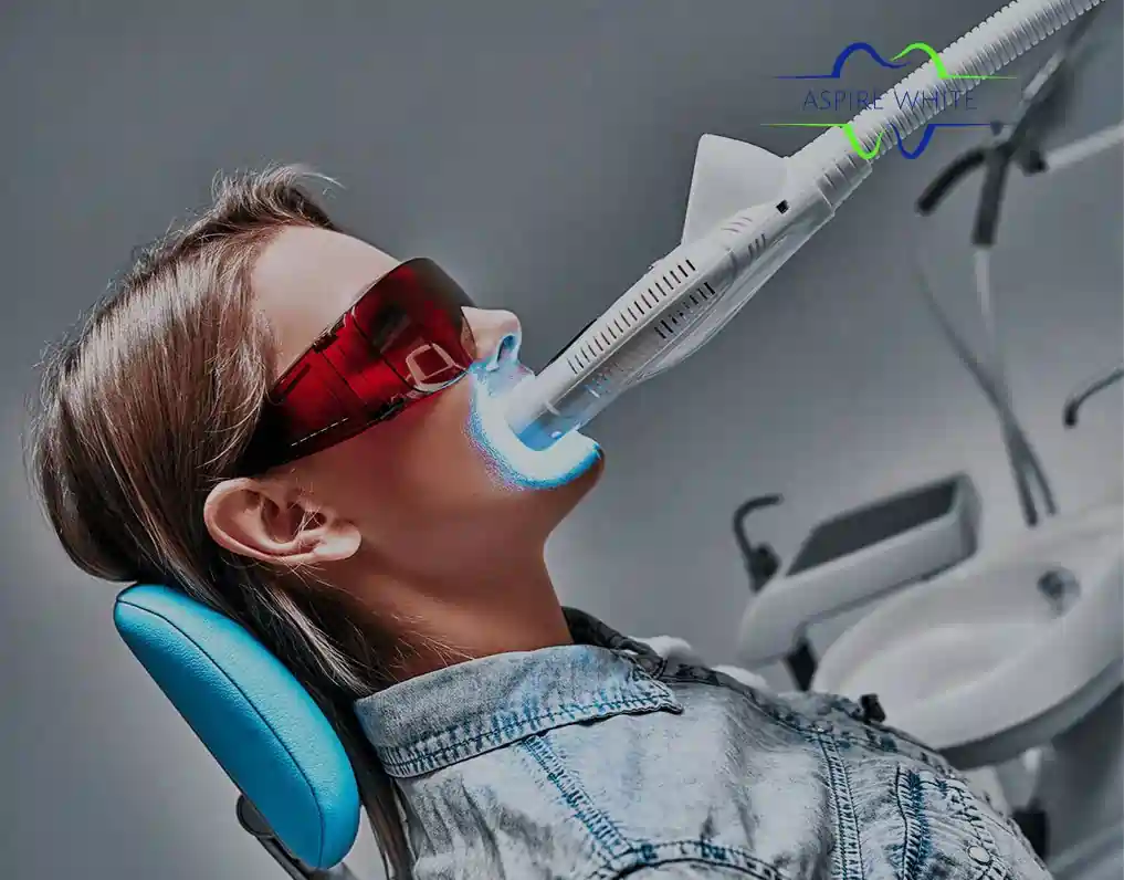 Patient relaxing in clinic chair during 1 hour laser teeth whitening session Cambridge